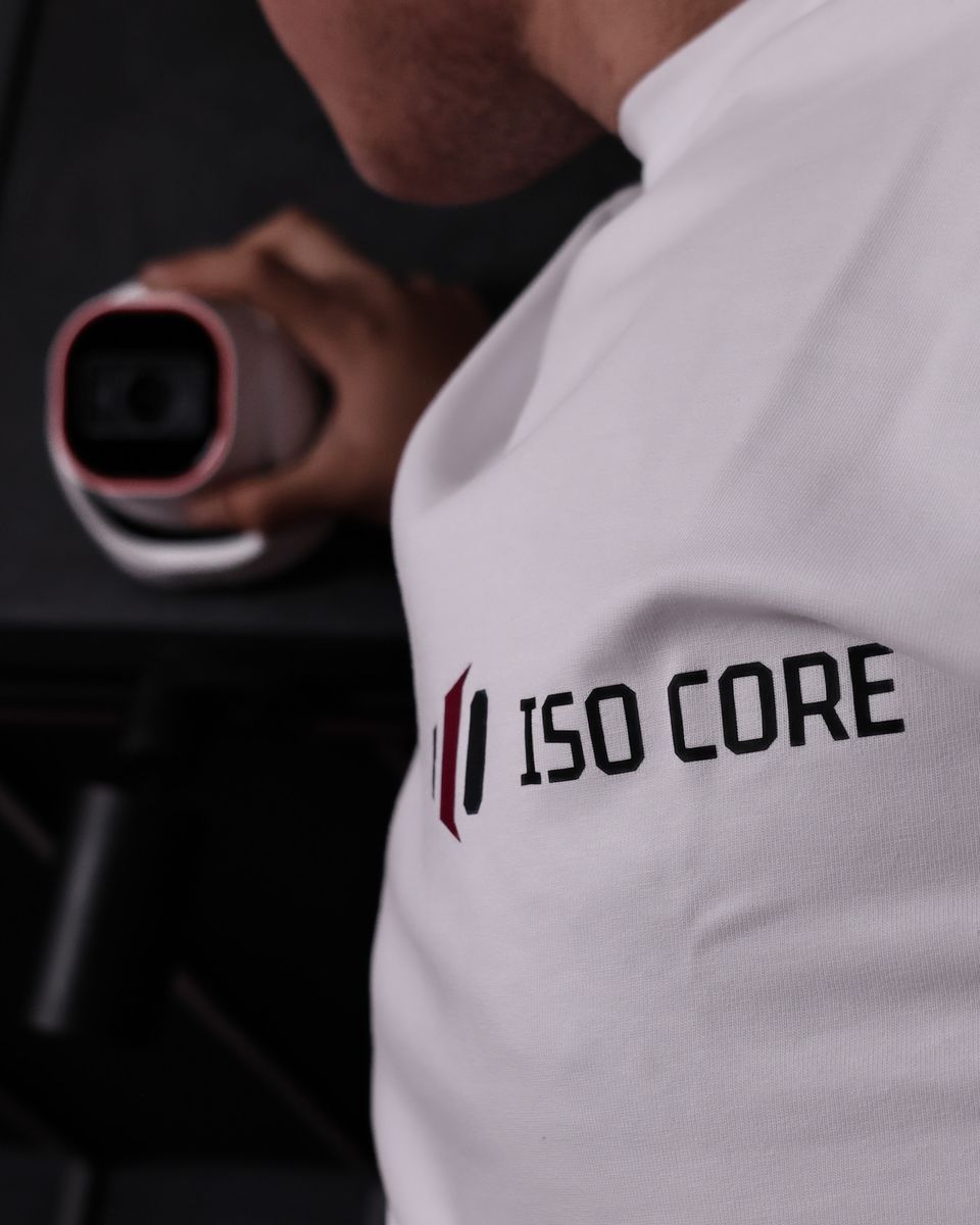 ISO CORE technician holding a security camera